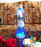 Fresh flowers in glass bottles