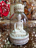 Buddha statue in glass bottle